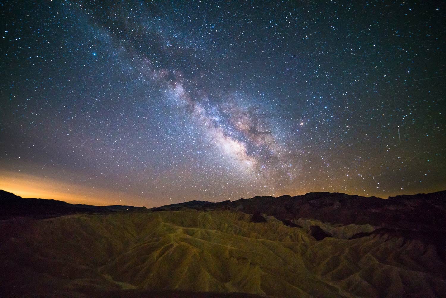 The Milky Way dances over Zabriskie Point in Death Valley