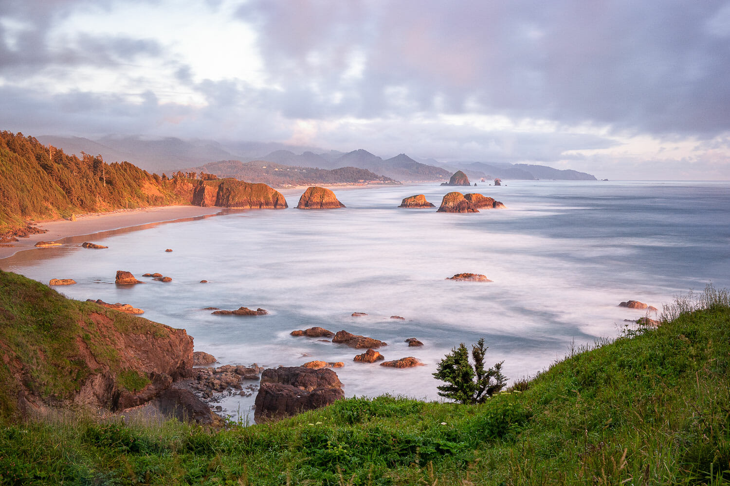 The beach at ecola state park on the oregon coast during an autumn sunset