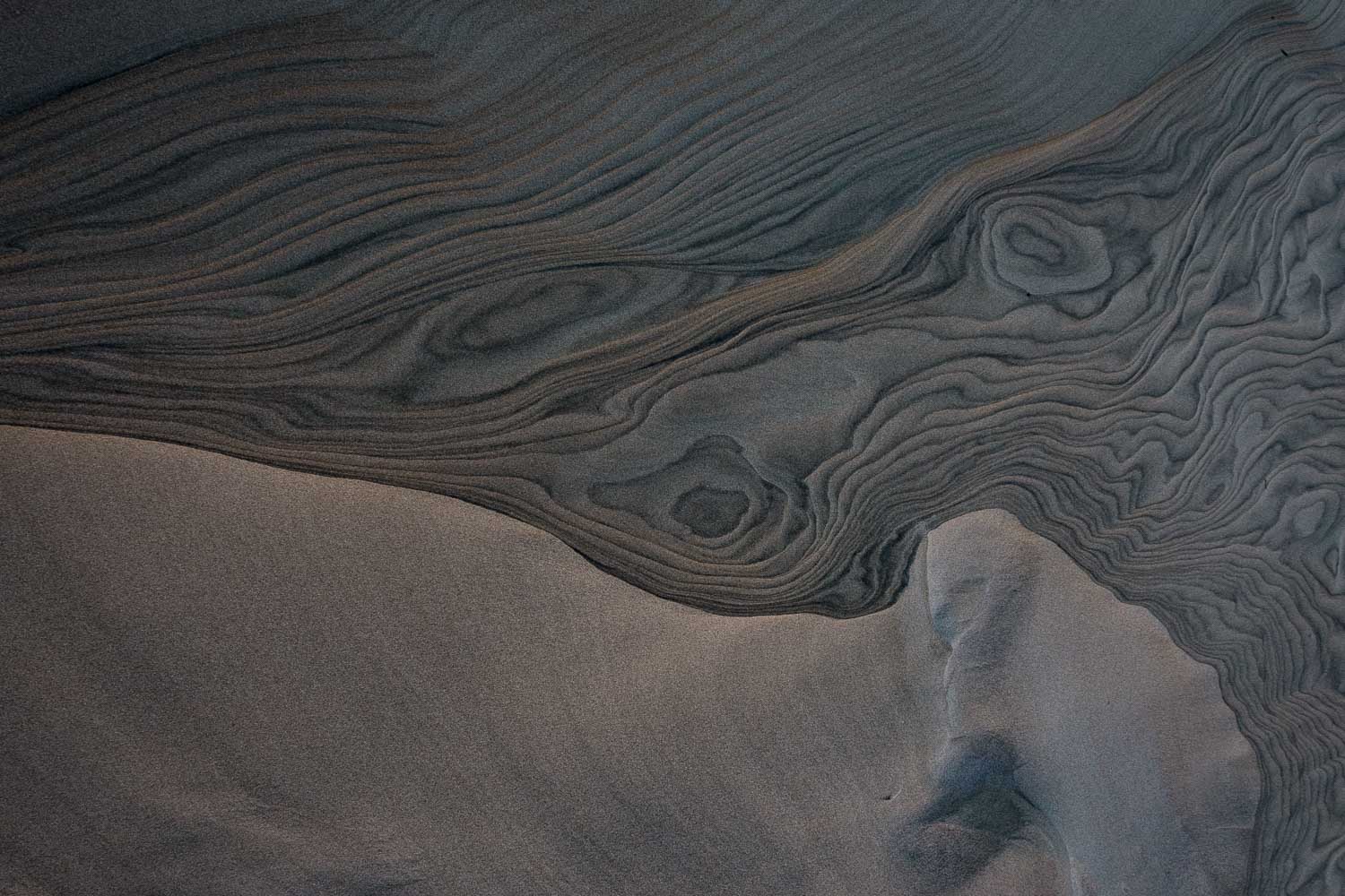 Abstract patterns and textures in sand.