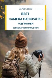 Woman with camera and backpack trekking through foggy woodland - gear guide: best camera backpacks.